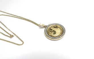 A 2008 Britannia gold and diamond pendant hung on a 9ct gold chain, 44cm long, 6.9g