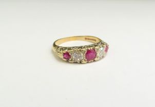 A 9ct gold ruby and diamond five stone ring. Size U, 4.7g