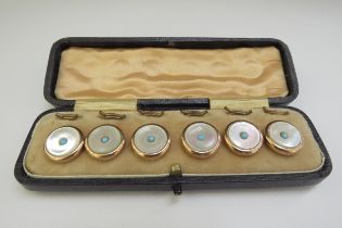 A set of turquoise and mother-of-pearl shirt studs, in fitted case