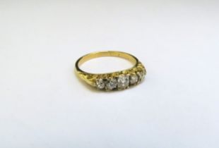 A gold five stone old cut diamond ring, unmarked. Size L, 2.5g