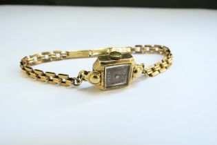 A 14ct gold cased wristwatch with a 9ct gold bracelet strap, 12.1g total