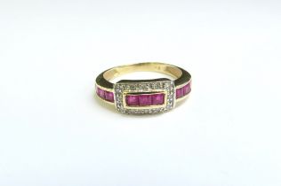 A 9ct gold ruby and diamond buckle style ring. Size K, 2.3g