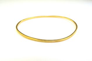 WITHDRAWN: A gold bangle, mis-shaped, unmarked, 12.1g