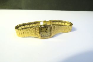 An Omega 9ct gold wristwatch, 29g