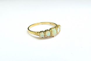 A 9ct gold five stone opal ring. Size S, 2.2g