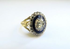 A Georgian diamond and blue enamel ring, the centre rose cut flatback diamond framed by blue