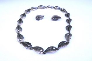 A mid century Danish silver necklace by John Lauritzen comprising leaf shaped decorative links,