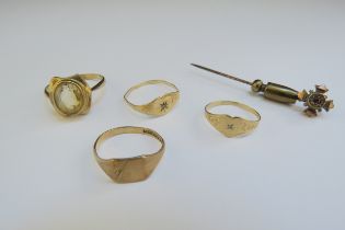 Four gold rings including two 9ct gold examples one with citrine, all a/f, and a 9ct stick pin, 5g