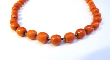 A coral necklace with facet cut beads, 46cm long