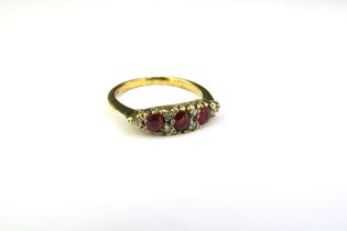 A gold ruby and diamond ring, shank stamped 18ct. Size L/M, 2.8g
