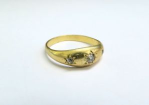A gold gypsy ring set with three diamonds in star setting, unmarked. Size S, 3.2g