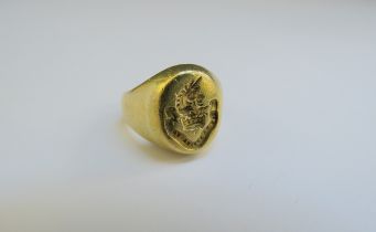 A gold signet ring with unicorn and crown crest, gold mark indistinct. Size I/J, 14g