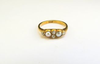 A pearl and diamond ring, stamped 18ct. Size K, 2.5g