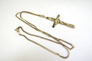 A 9ct gold crucifix (dented), hung on 9ct gold chain, 46cm long, 4.7g