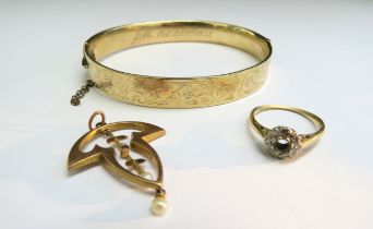 A 9ct gold bronze core filled bangle, 18ct gold ring with diamond framed, centre stone missing and