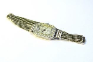 A diamond set cocktail watch with Chaincraft adjustable strap, clasp stamped 9ct white gold, 18.3g