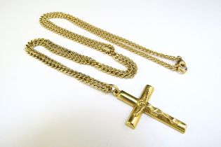 A gold chain, 60cm long stamped 585 hung with a gold crucifix marked 750, 17.7g total