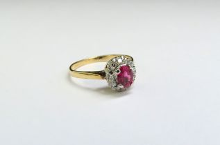 A ruby and diamond cluster ring, marks rubbed. Size L, 2.1g