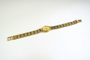 A 9ct gold Accurist wristwatch with 9ct gold strap, 14g