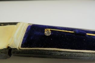 A diamond set stick pin 0.15ct approx, cased