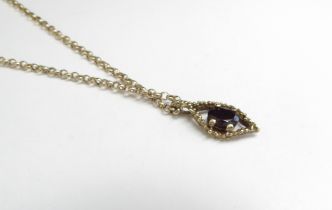 A 9ct gold chain, 52cm long hung with a 9ct gold garnet pendant, 4.6g
