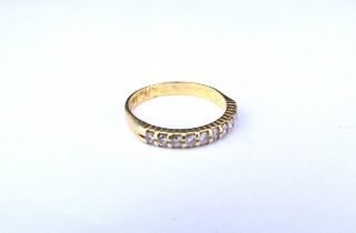 A gold half hoop diamond ring, unmarked. Size L, 2.1g