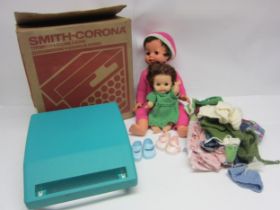 Two mid 20th Century English soft plastic dolls including Rosebud, a quantity of clothing and a