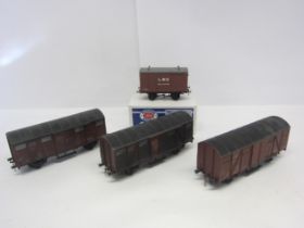 Three Lima 0 gauge BR Ferry Van wagons and a Peco Parkside Models kit built PS09 LMS Ventilated