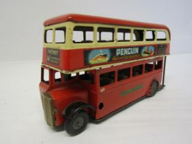 A Triang Minic 60M clockwork tinplate double decker London bus in red and cream, route number 14