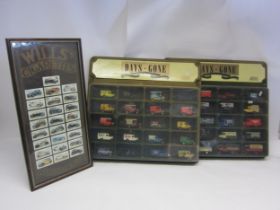 Two Lledo Days Gone wall mounting shop displays containing a total of forty diecast vehicles,