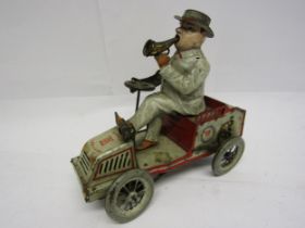 An early 20th Century Lehmann (Germany) Tut Tut white and red tinplate motor car with gentleman