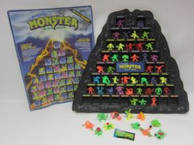 A Matchbox Monster In My Pocket display stand, Series 1 card checklist poster and assorted figures