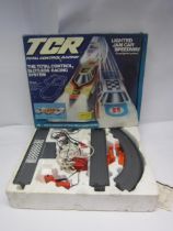 A boxed TCR Total Control Racing Lighted Jam Car Speedway slotless racing set, one car only