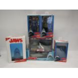 A collection of boxed models and figures relating to Steven Spielberg's 'Jaws', to include Neca '