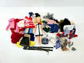 A vintage Sindy fashion doll, head marked 'Made in Hong Kong', together with assorted official and