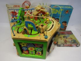 A large wooden educational playset and three vintage games to include Risk, Tip-It and