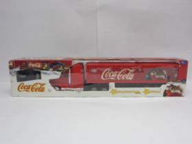 A boxed radio control Coca-Cola Christmas truck