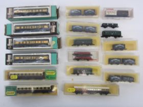 A collection of N gauge model railway rolling stock including boxed, cased and loose examples and