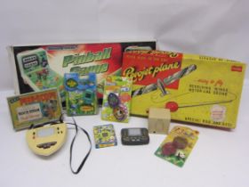 Mixed toys including Palitoy Revojet plane, Powco Pinball Game, Kay Peep-Scope, Tomytronic 3-D