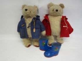 Two vintage Gabrielle Designs Paddington Bears, one in red duffle coat, the other blue, each 48cm