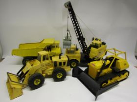 Four 1970s Mighty Tonka pressed steel construction vehicles to include crane, T-9 dozer, loader
