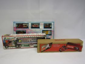 Three boxed Christmas themed plastic toys to include Freightliner Coca-Cola lorry, Peha Christmas
