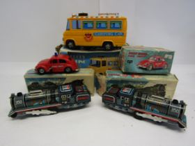 Four boxed vintage Japanese toy vehicles to include battery operated plastic Melody Camping Car,