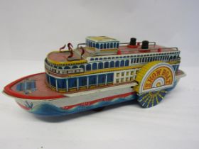 An unboxed vintage Nomura TN (Japan) battery operated litho printed tinplate Show Boat, 33cm long