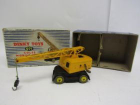 A Dinky 971 diecast Coles Mobile Crane in yellow with jib and hook, housed in blue striped pictorial