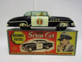 A Welsotoys TV related tinplate Highway Patrol Gyro Car, friction drive motor, original pictorial