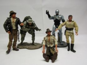 Four assorted poseable action figures to include McFarlane Toys RoboCop, Gabrielle Lone Ranger and