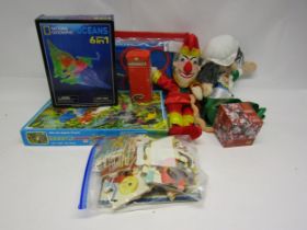 A mixed group of toys and games including Punch and Judy glove puppets, National Geographic Laser
