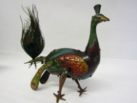 An early 20th Century litho printed tinplate clockwork peacock novelty toy