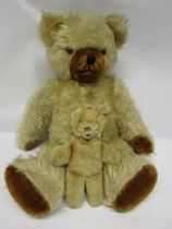 A golden mohair articulated teddy bear with black boot button eyes, brown muzzle and pads, 50cm